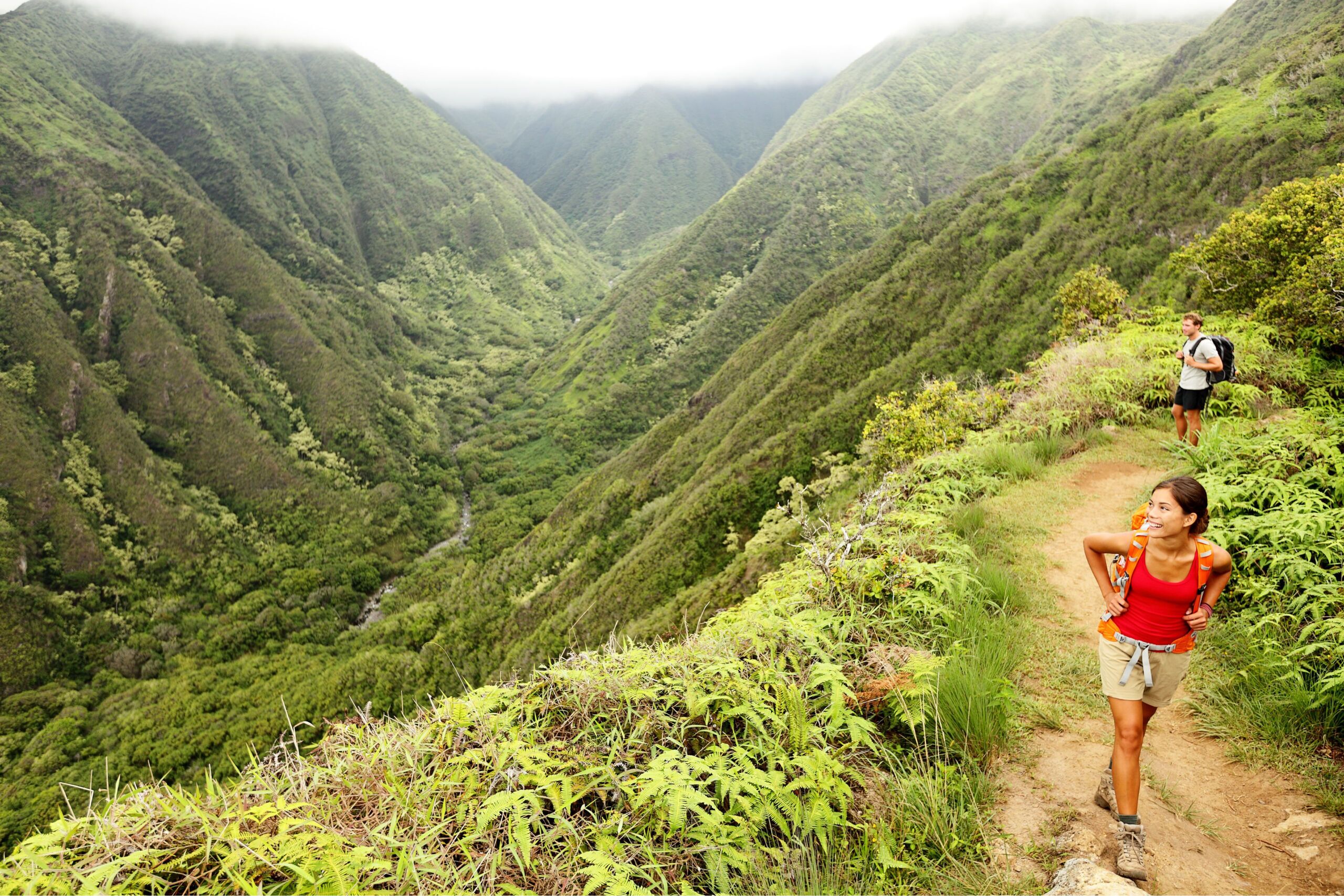A woman hiking on the ridgeline trail in Hawaii, one of the best places for hiking in hawaii 