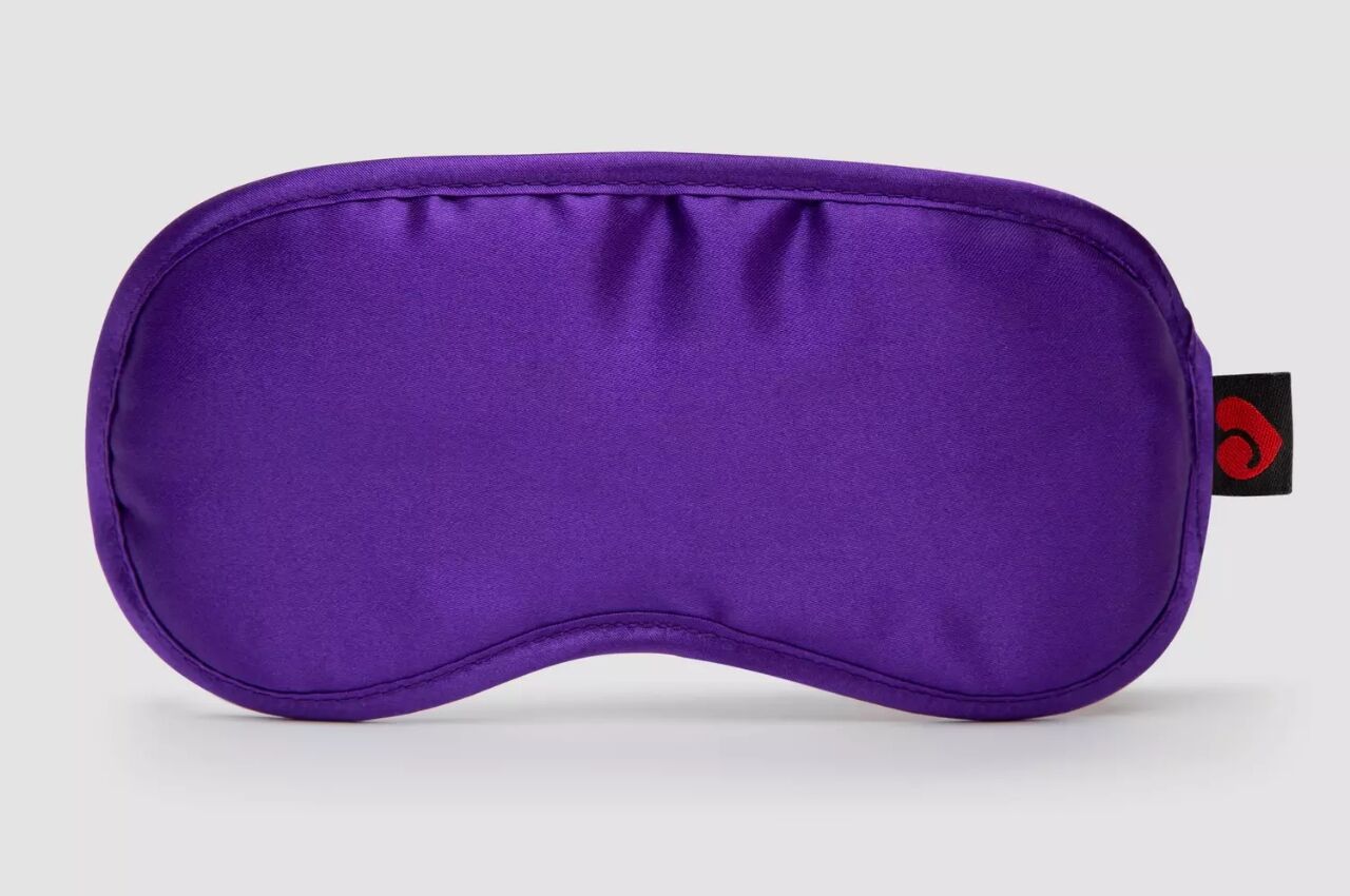 Purple silk blindfold for travel. 