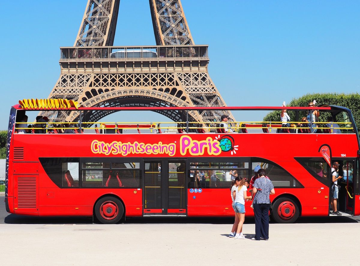 Red Double Decker Bus With Tourists In Paris Near The Eiffel Tower 1200x888 