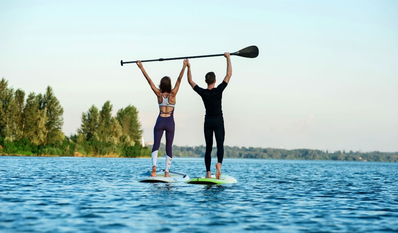 Couple on stand-up paddle board 