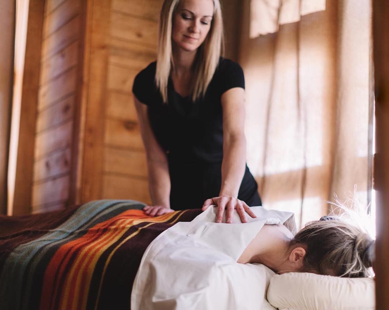 Woman getting a massage at the Sundance Mountain ski and spa resort in Utah