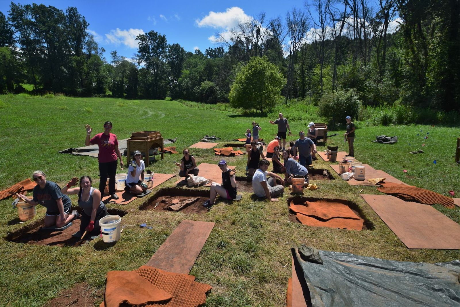 A group of people working on an archeological dig in Vermont