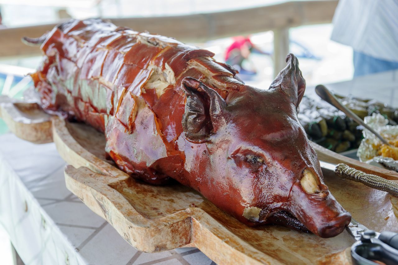 Lechon, on a platter, a traditional Christmas dinner in the Philippines