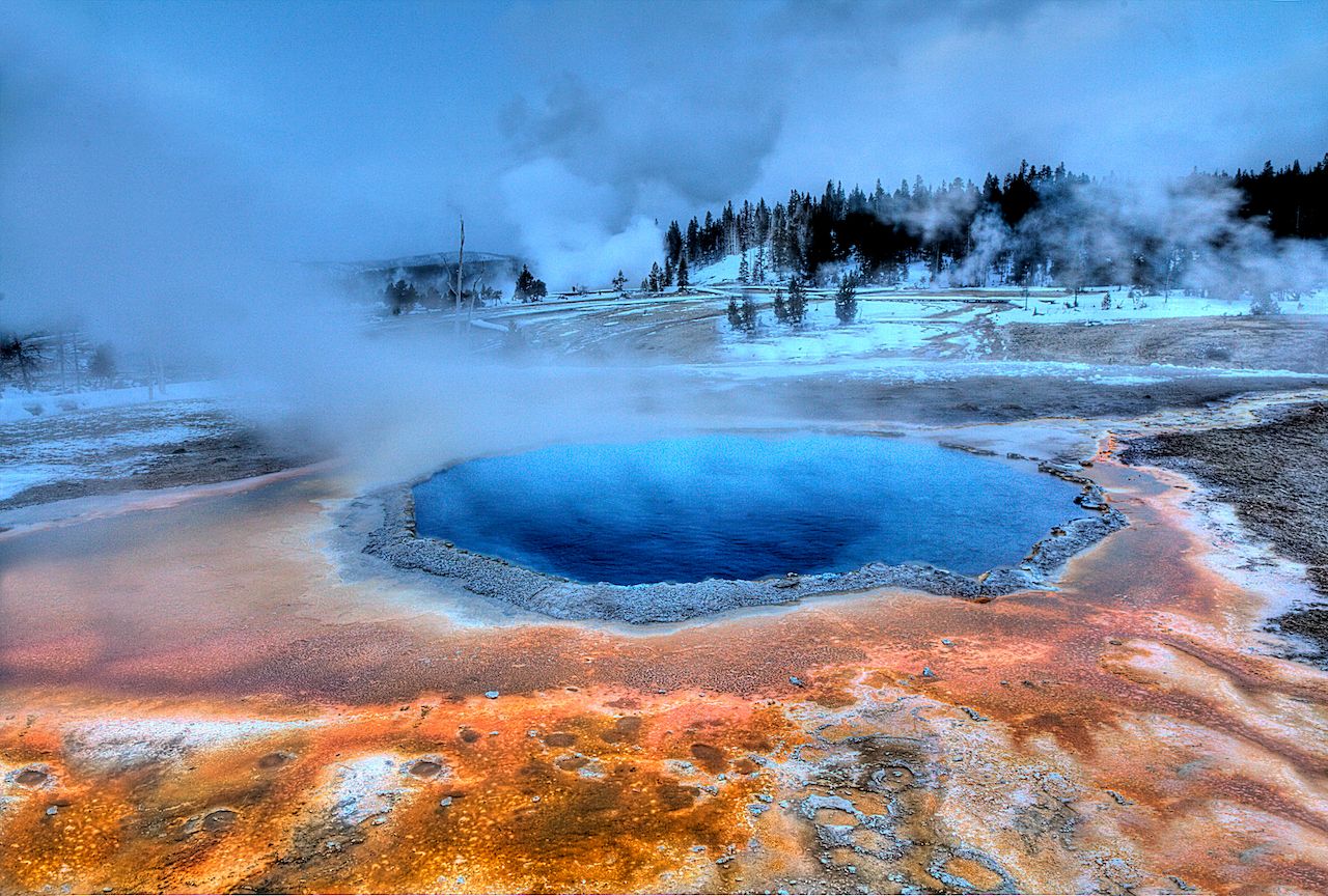 Steam rising from a hot water geyser in Yellowstone National Park in the winter