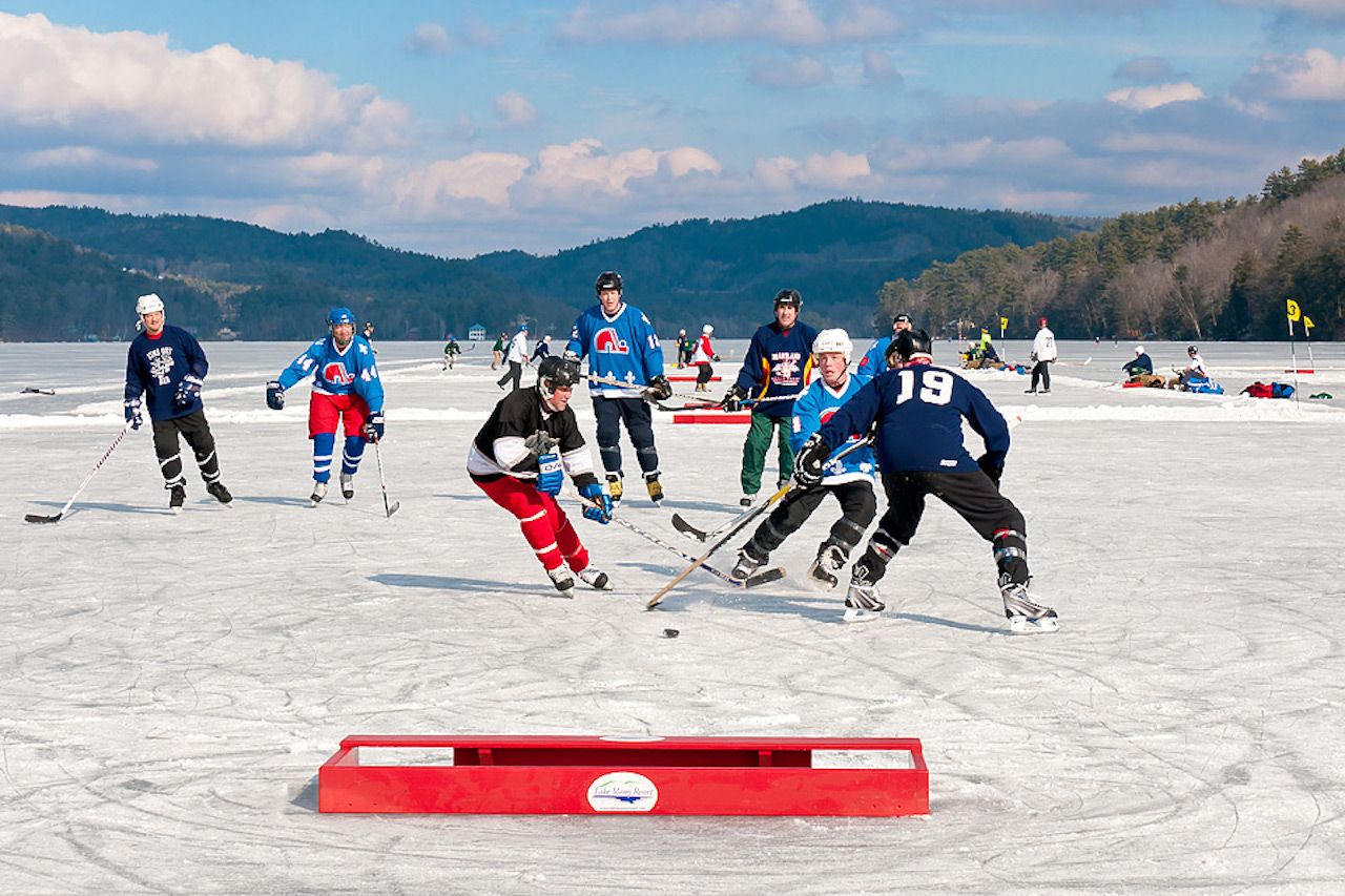 Men playing hockey on frozen Lake Morey, Vermont