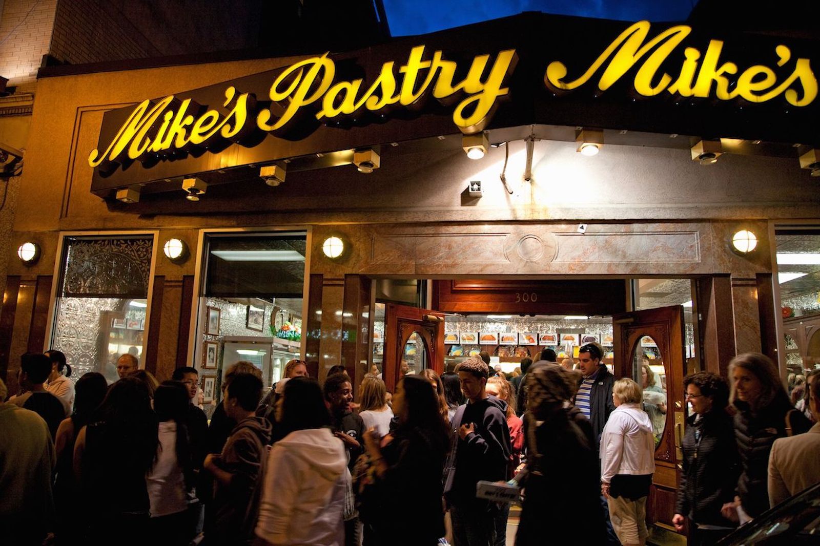 Crowd gathers in front Mike's Pastry in Boston's Little Italy