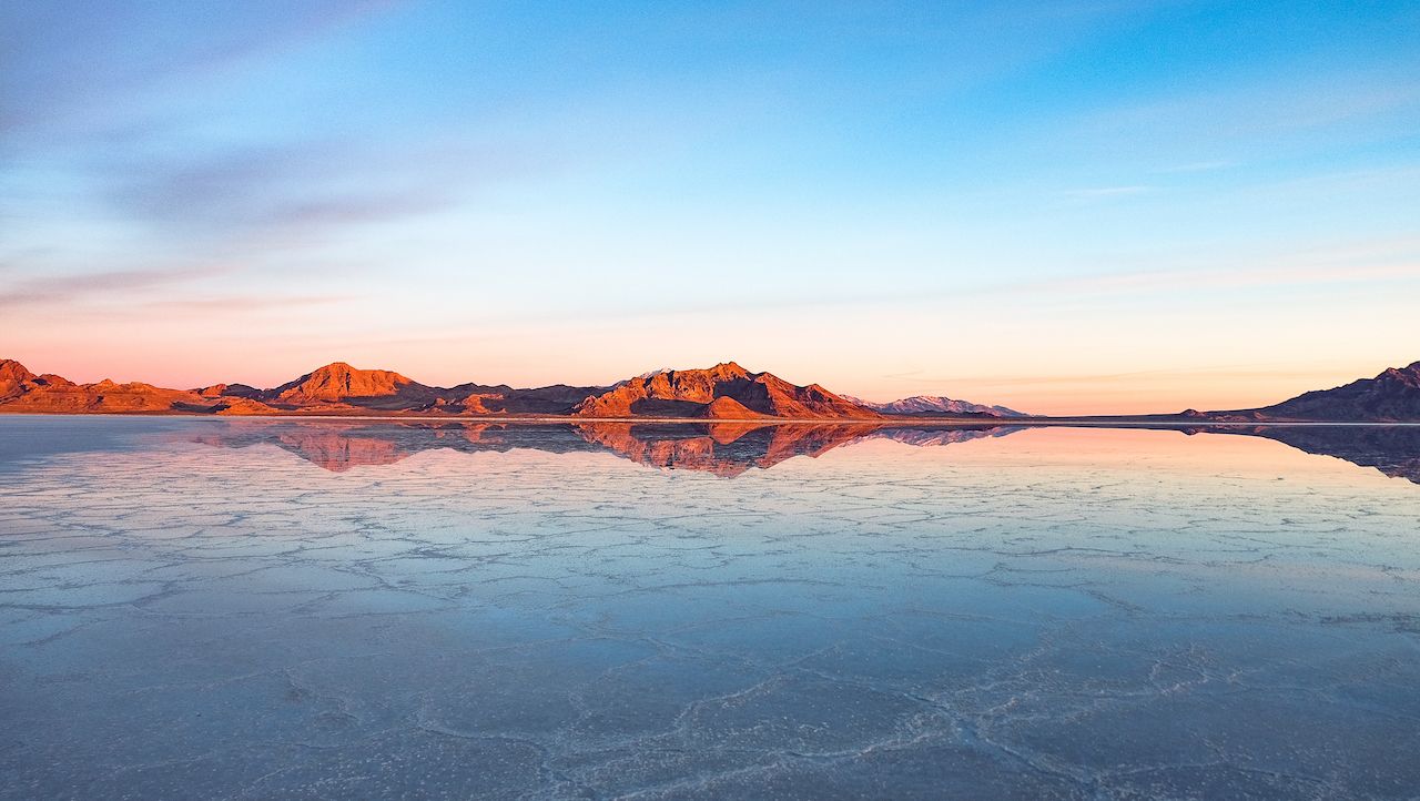 A wide angle view of the Bonneville Salt Flats at sunset in the winter