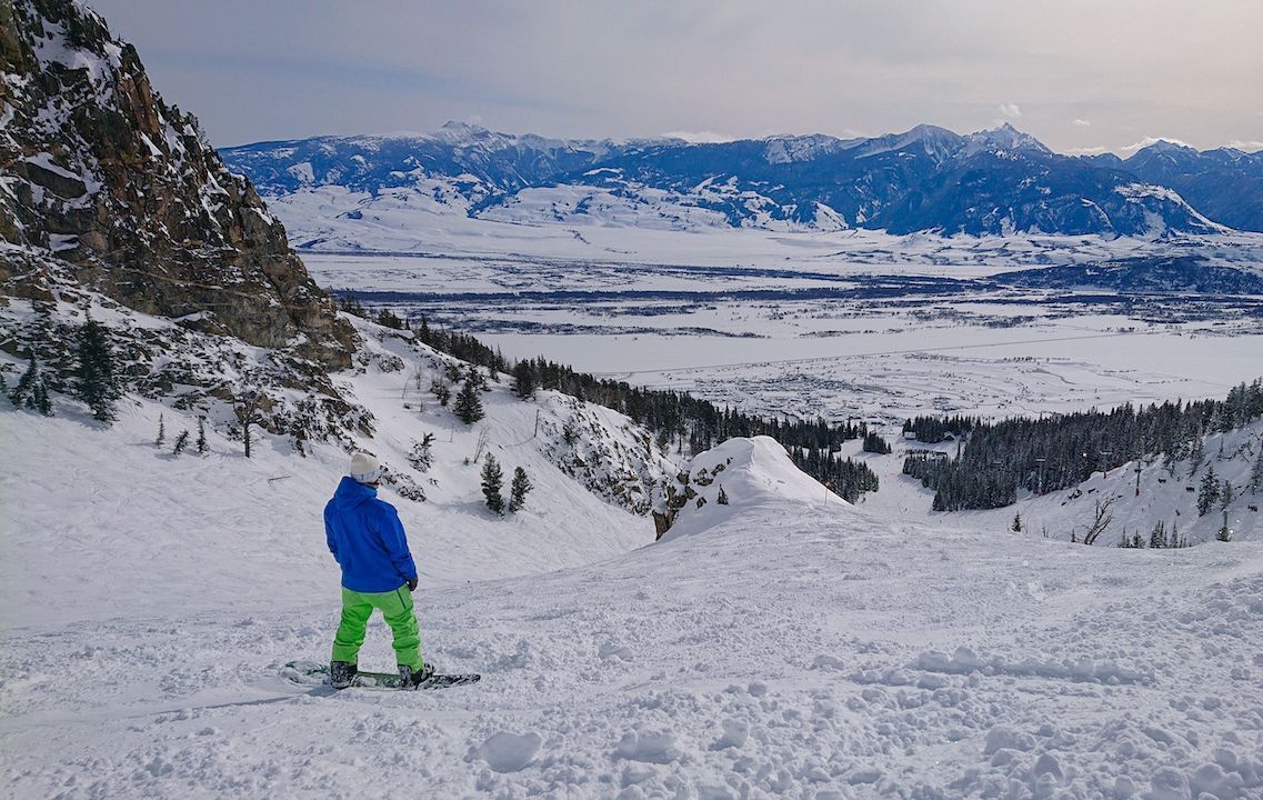 Snowboarder on a hill in Jackson Hole, Wyoming