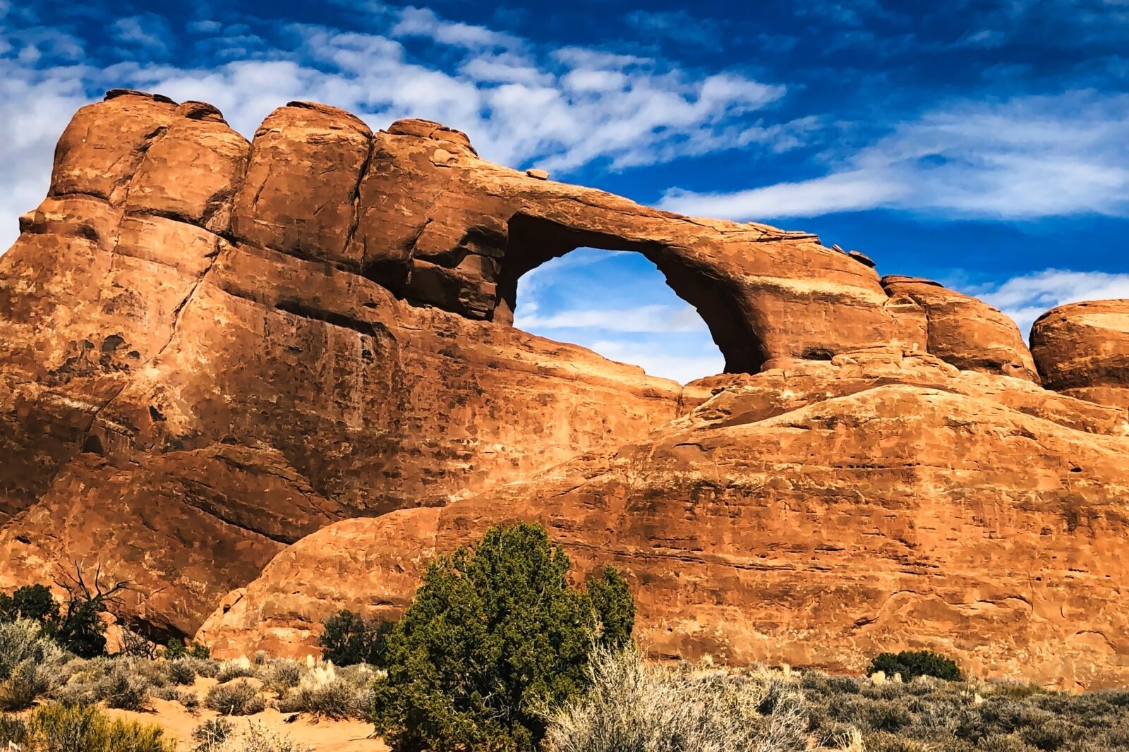 Autumn at the Skyline Arch in Arches National Park in Utah one of the best national parks to visit in the fall 
