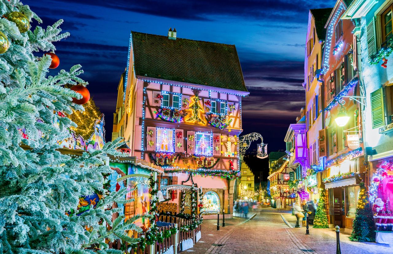 A street in Colmar, France completely decorated with Christmas lights