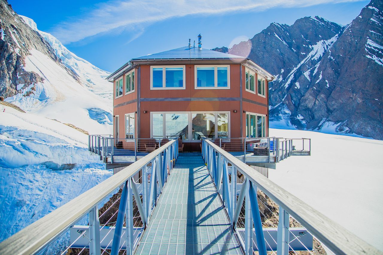 Sheldon Chalet, a luxury backcountry lodge, perched between mountains in Alaska