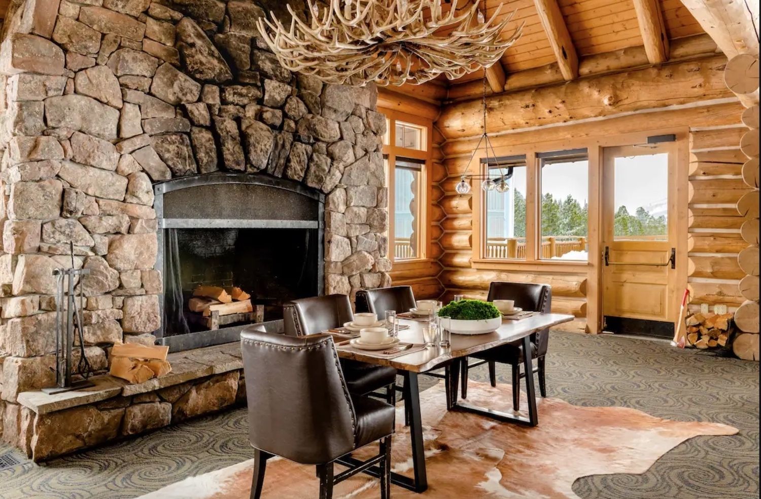 Airbnb Andesite Mountain in Big Sky, Montana fireplace and dining room, airbnb montana mountain stay