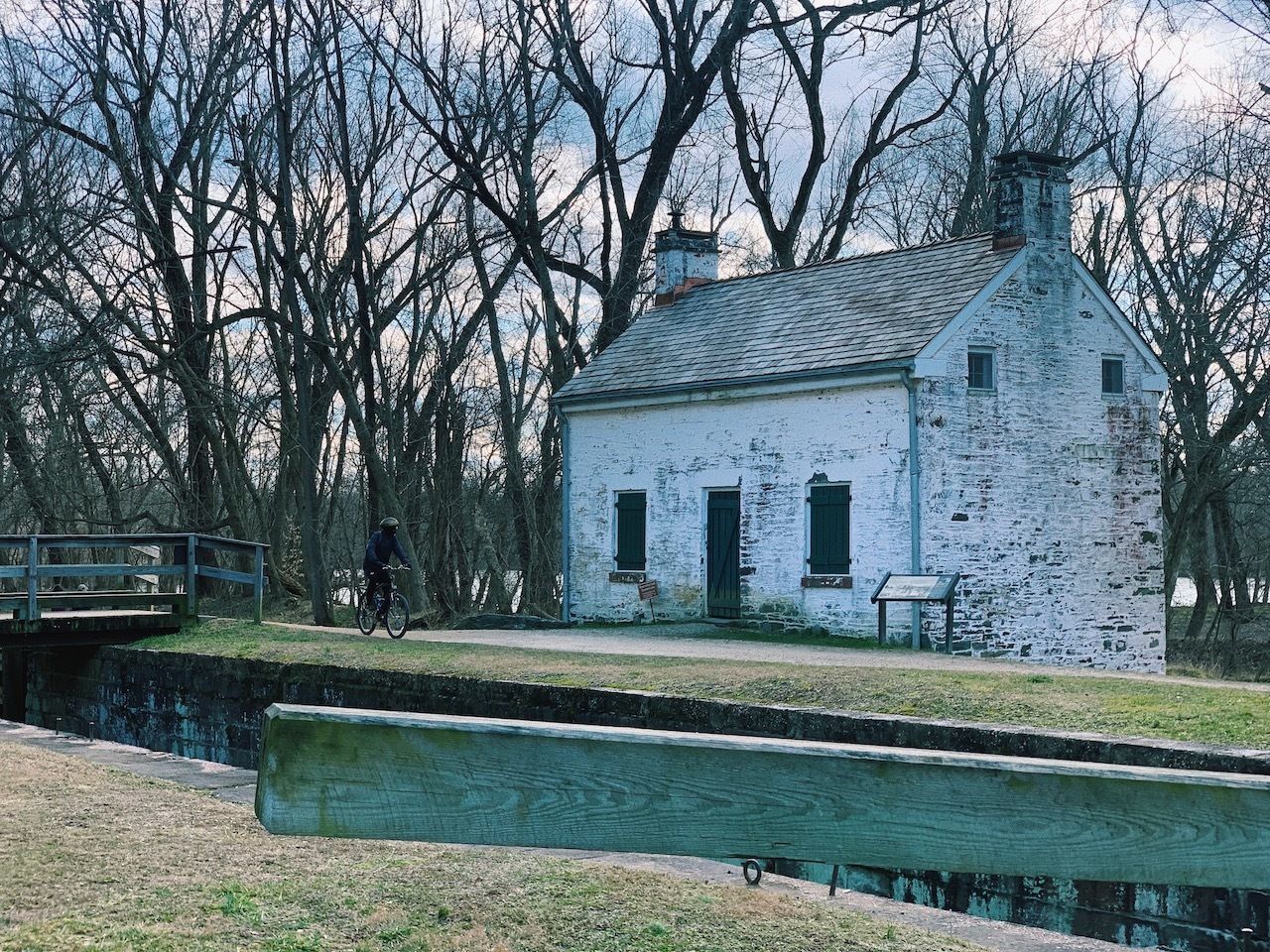 outside of a rustic lockhouse