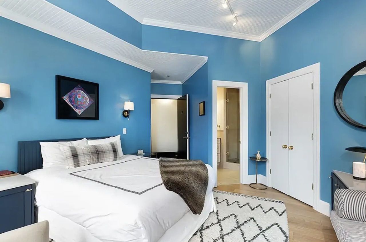 Room in historic downtown Aspen in boutique hotel bedroom with blue walls, Airbnbs in Aspen