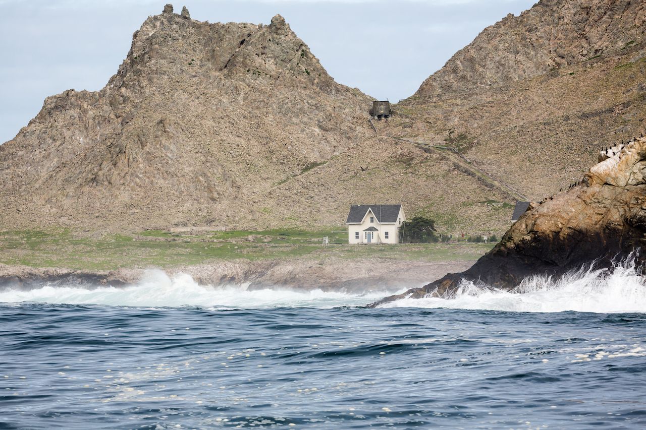 Farallon Islands lighthouse off coast of San Francisco in the Gulf of Farallon on a sunny, clear day, Islands in San Francisco Bay