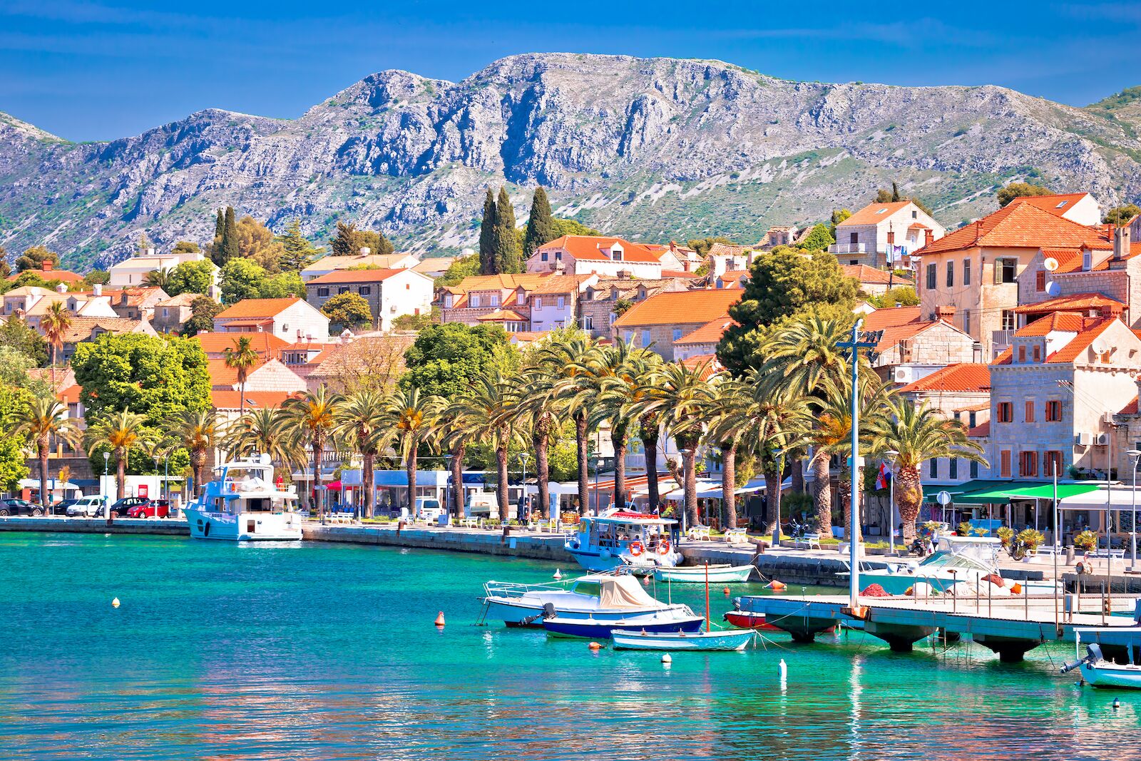 The picturesque town of Cavtat with mountains and the turquoise waters of the bay