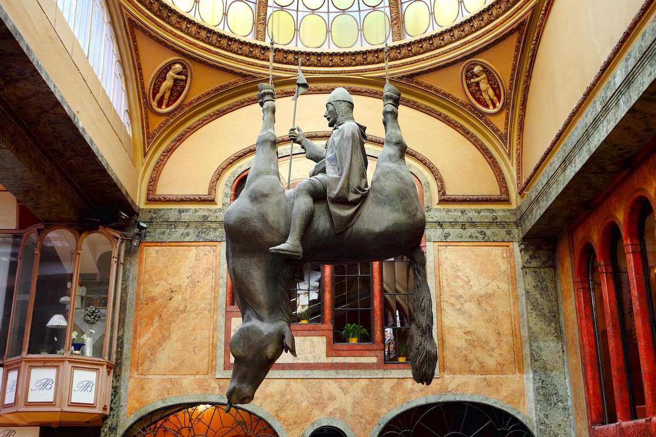 Prague, Czech Republic - April 24, 2015: sculpture by artist David Cerny that is hanging in the Lucerna Palace since 2000 is a controversial adaptation of the statue of St Wenceslas, Prague art and culture