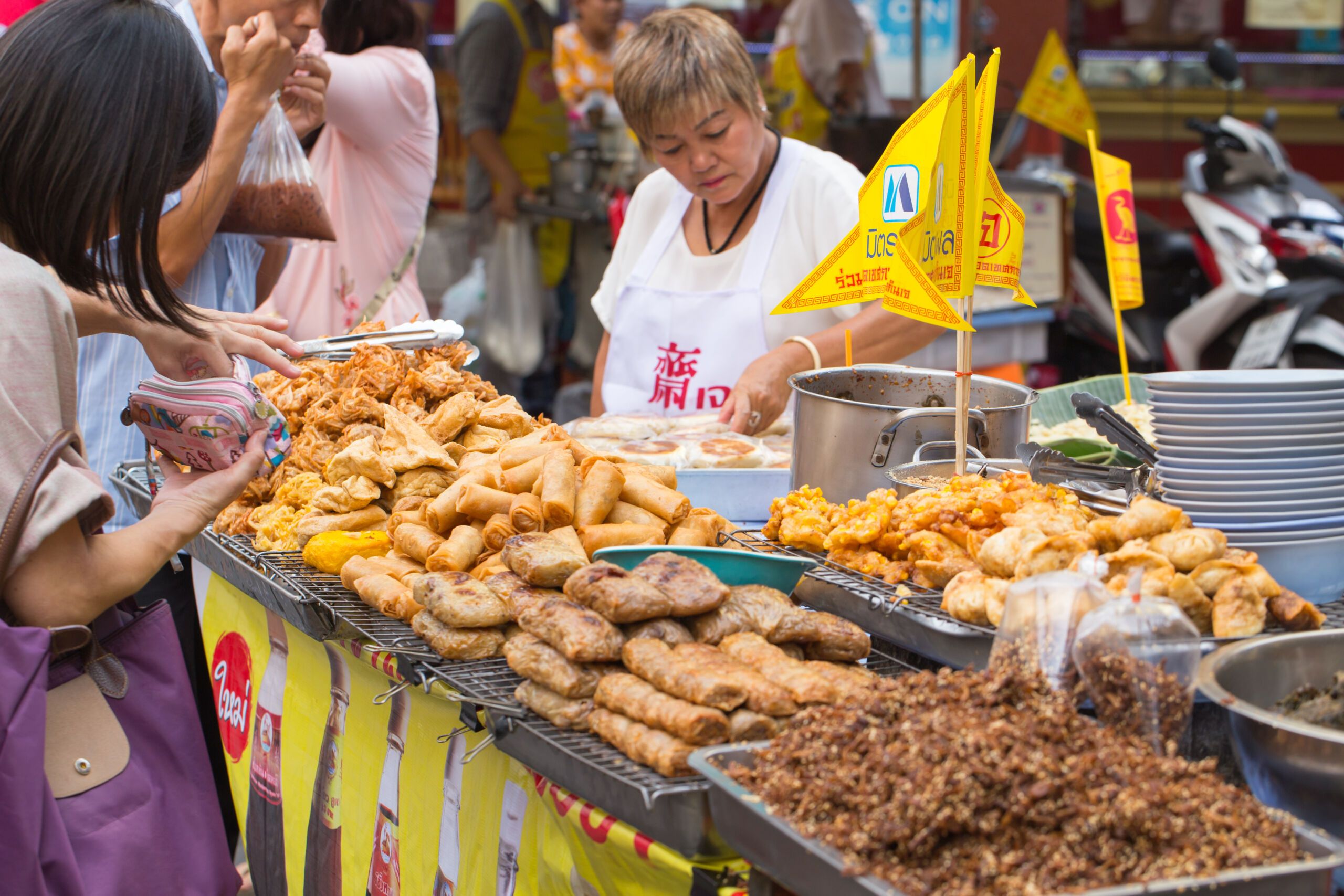 BANGKOK,THAILAND-AUGUST 30 2016: Yaowarat or Bangkok China town street food decoration with yellow flag in Vegetarian Festival In Thailand 2016., bangkok events
