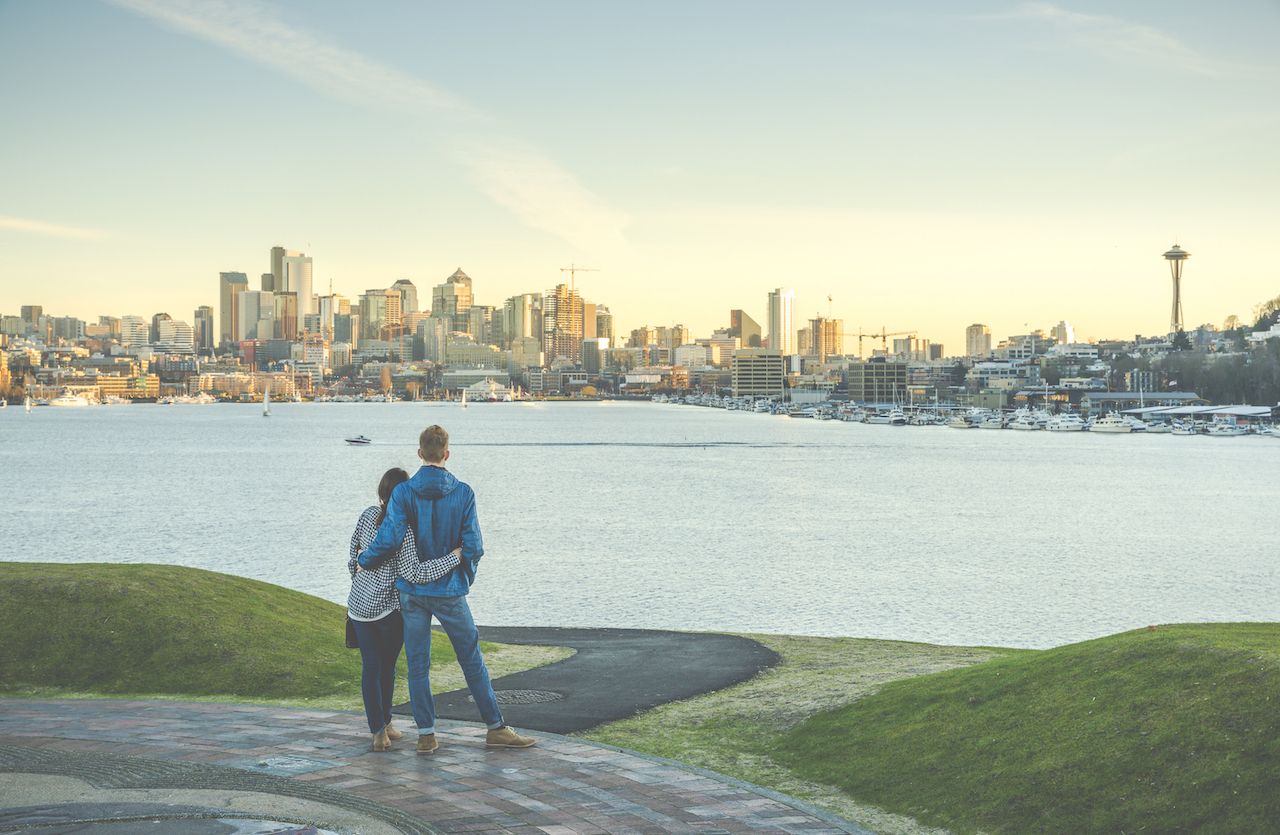 A,Couple,Hug,And,Looking,Seattle,City,Landscape,With,Sunset, Top babymoon destinations