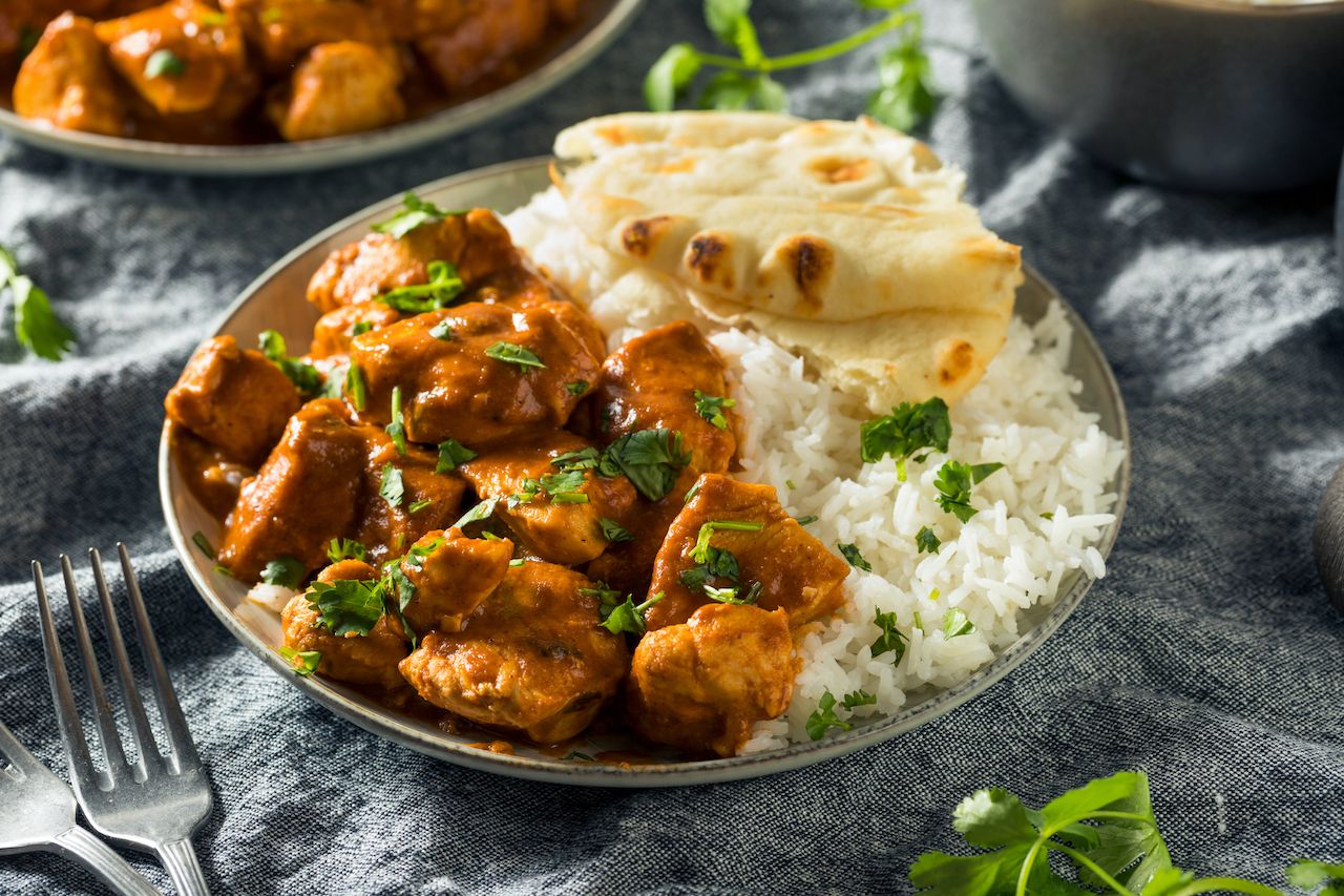 Homemade,Chicken,Tikka,Masala,With,Rice,And,Naan, Difference between butter chicken and chicken tikka masala