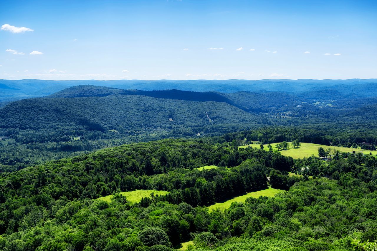 The rolling hills of the northwestern part of Connecticut in Salisbury as seen from the top of Lions Head on the Appalachian Trail in summer.