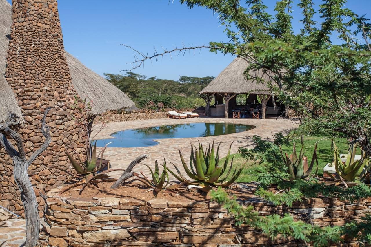 View of the pool and open-air dining room at the El Karama Lodge in Kenya