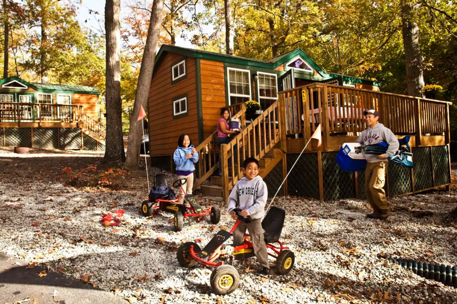 Family outside of Cozy Williamsburg cabin one of the best Christmas Airbnbs in America 
