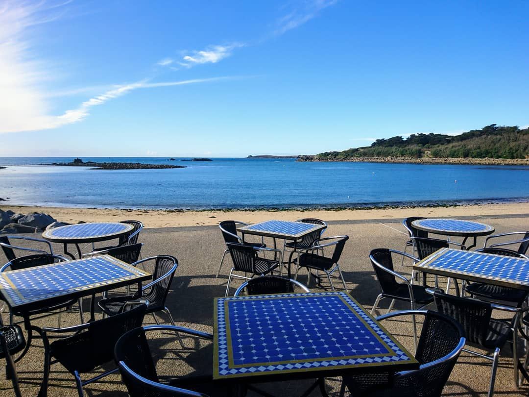 Outside tables by the sea at Dibble & Grub restaurant Isles of Scilly