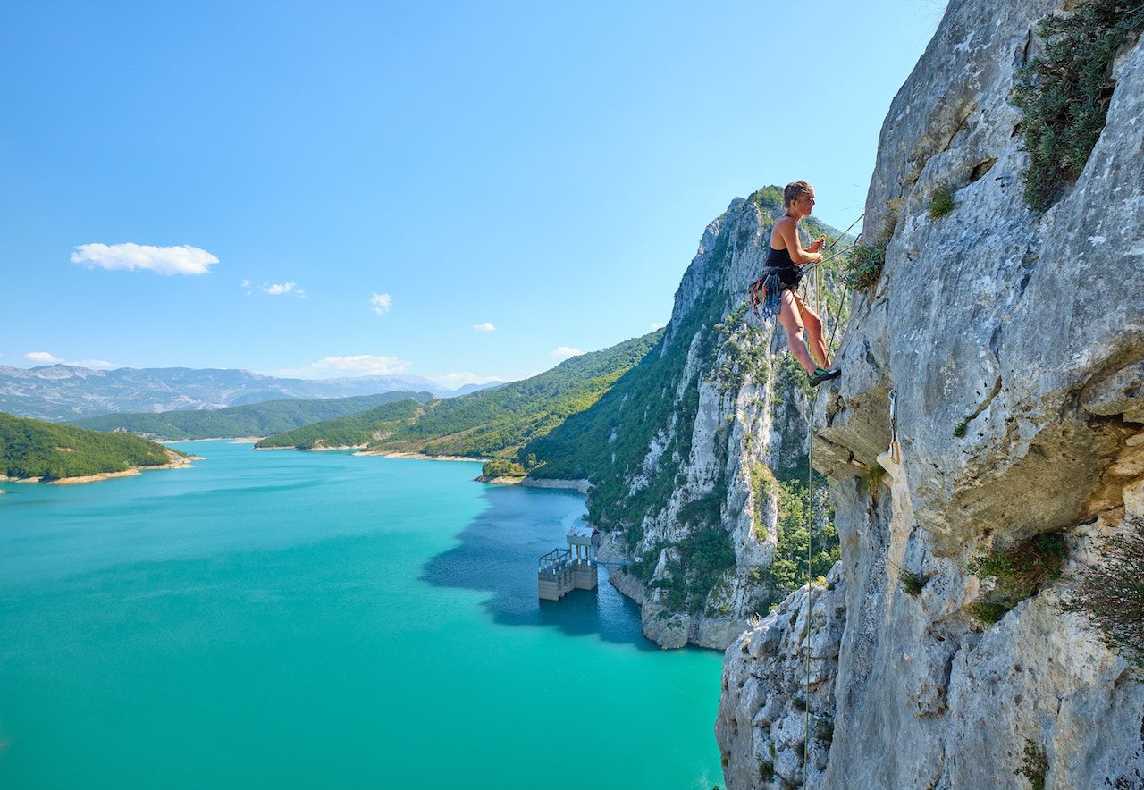 Woman climbing near Tirana, Albania 
