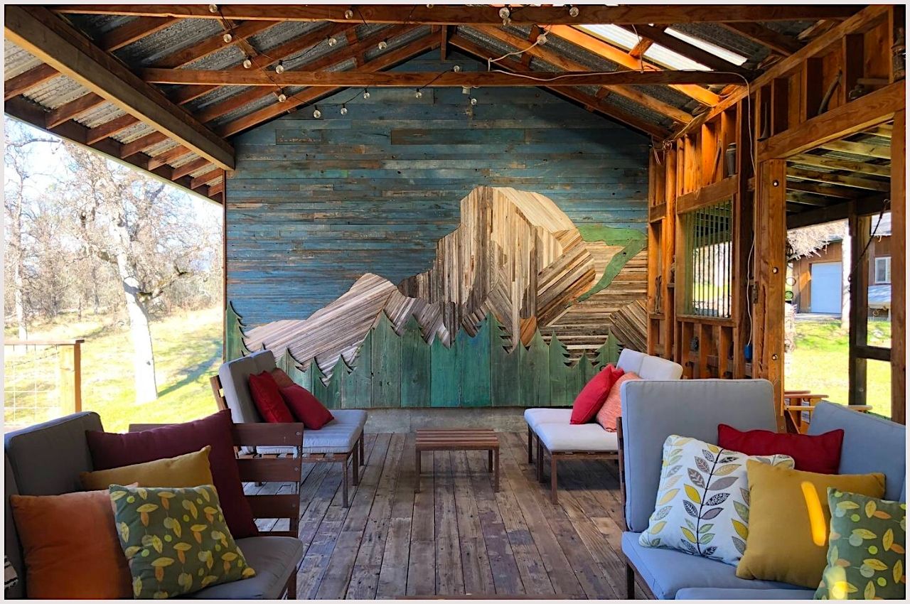 A covered outdoor space decorated with couches and tables at a popular Yosemite Airbnb rental