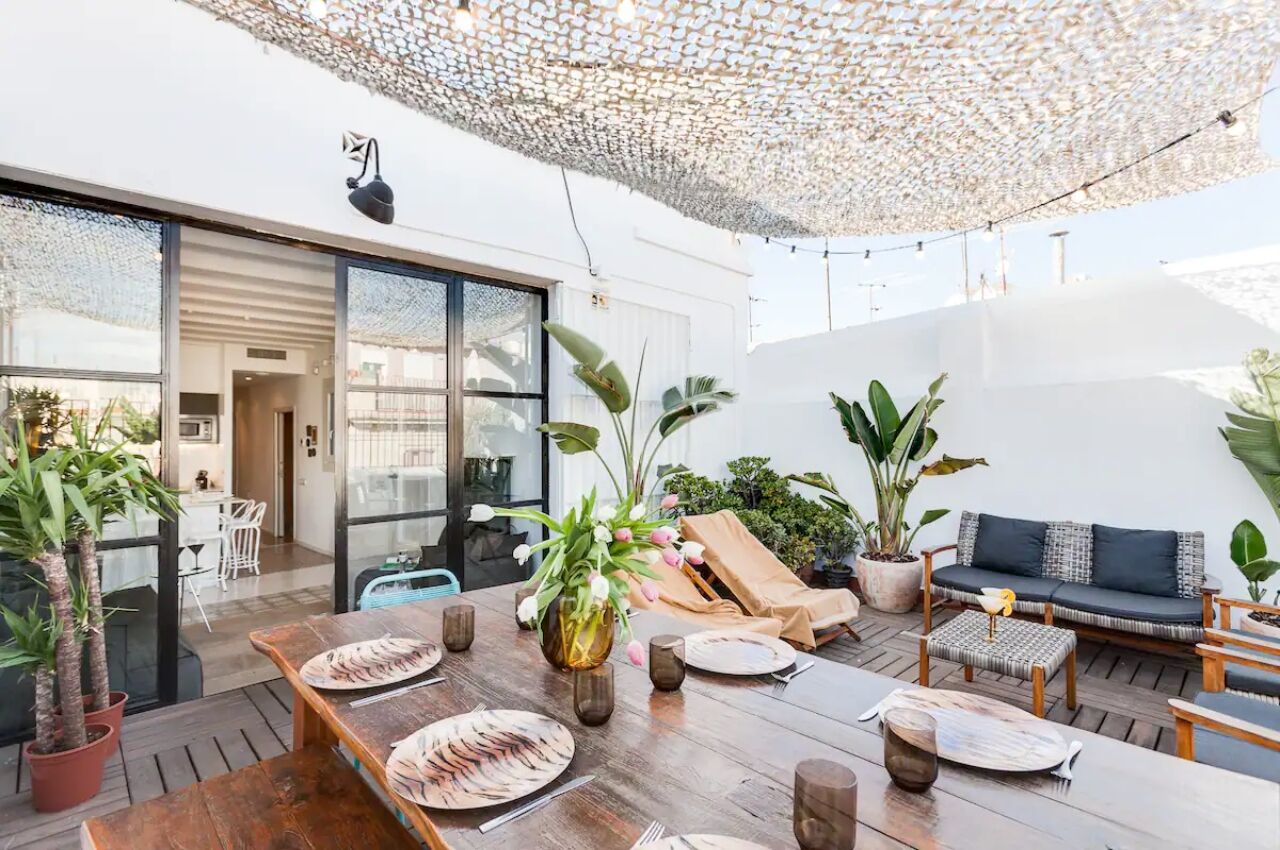 spacious patio area of the amazing penthouse airbnb in las ramblas