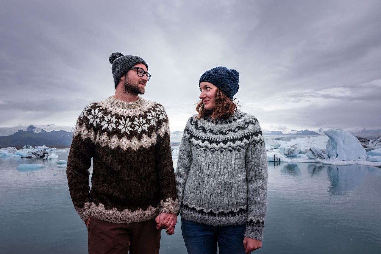 Couple wearing Icelandic sweaters