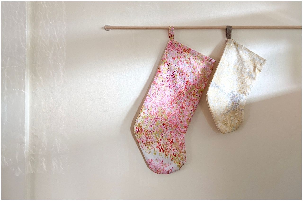 Light colored Christmas stockings that are Scandinavian in design 
