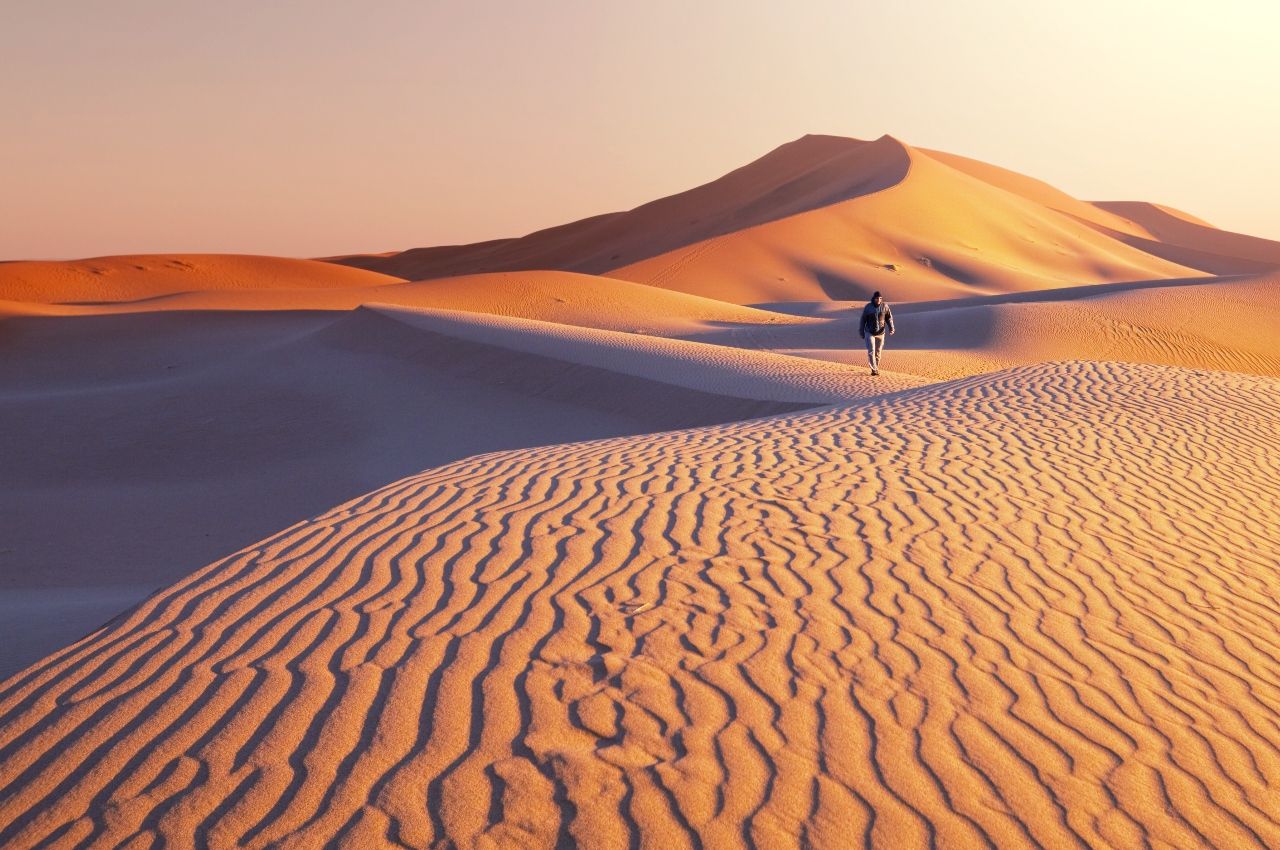 Gobi Desert landscape shot with man walking in the background
