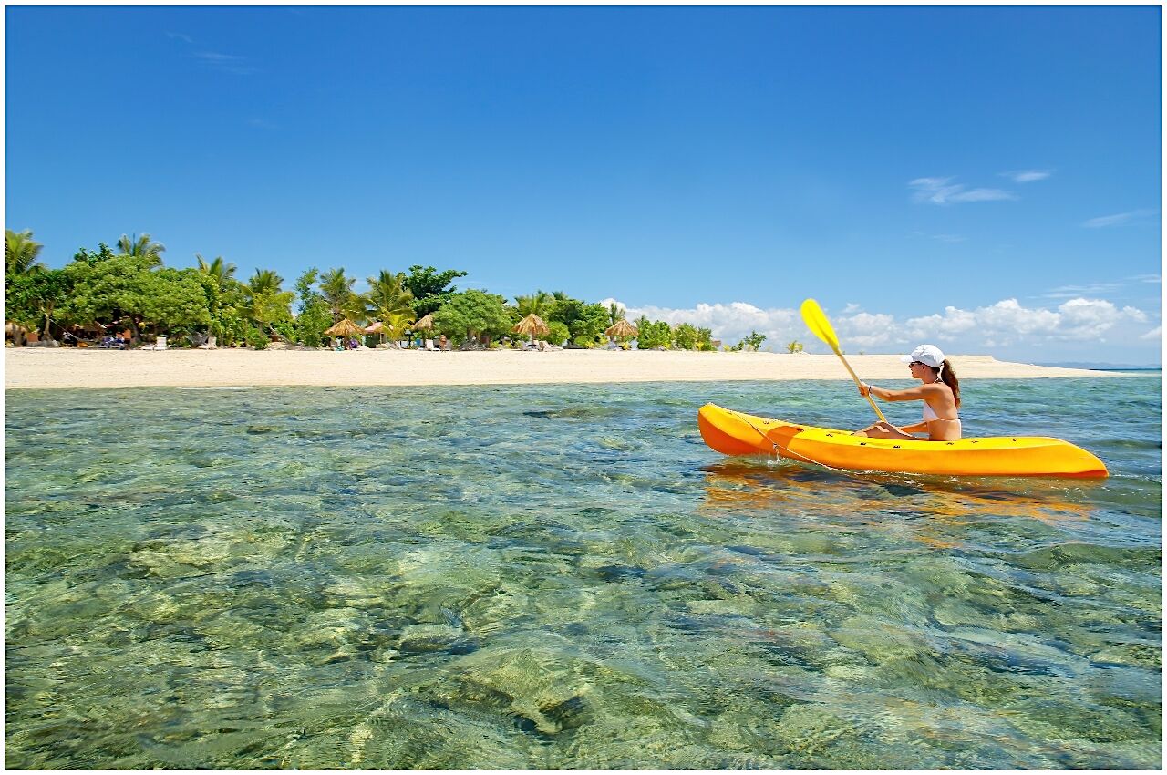 woman kayaking Mamanuca Islands 
