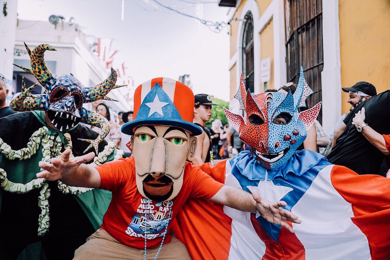 san sebastian festival goers dressed up in masks and costumes