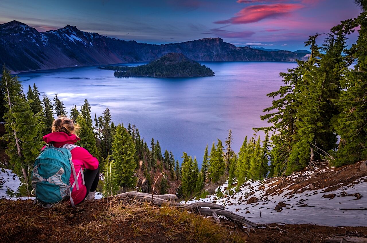 Women sitting looking out over Crater Lake