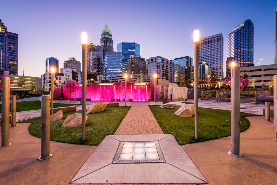 a park in downtown charlotte, north carolina overlooking the skyline