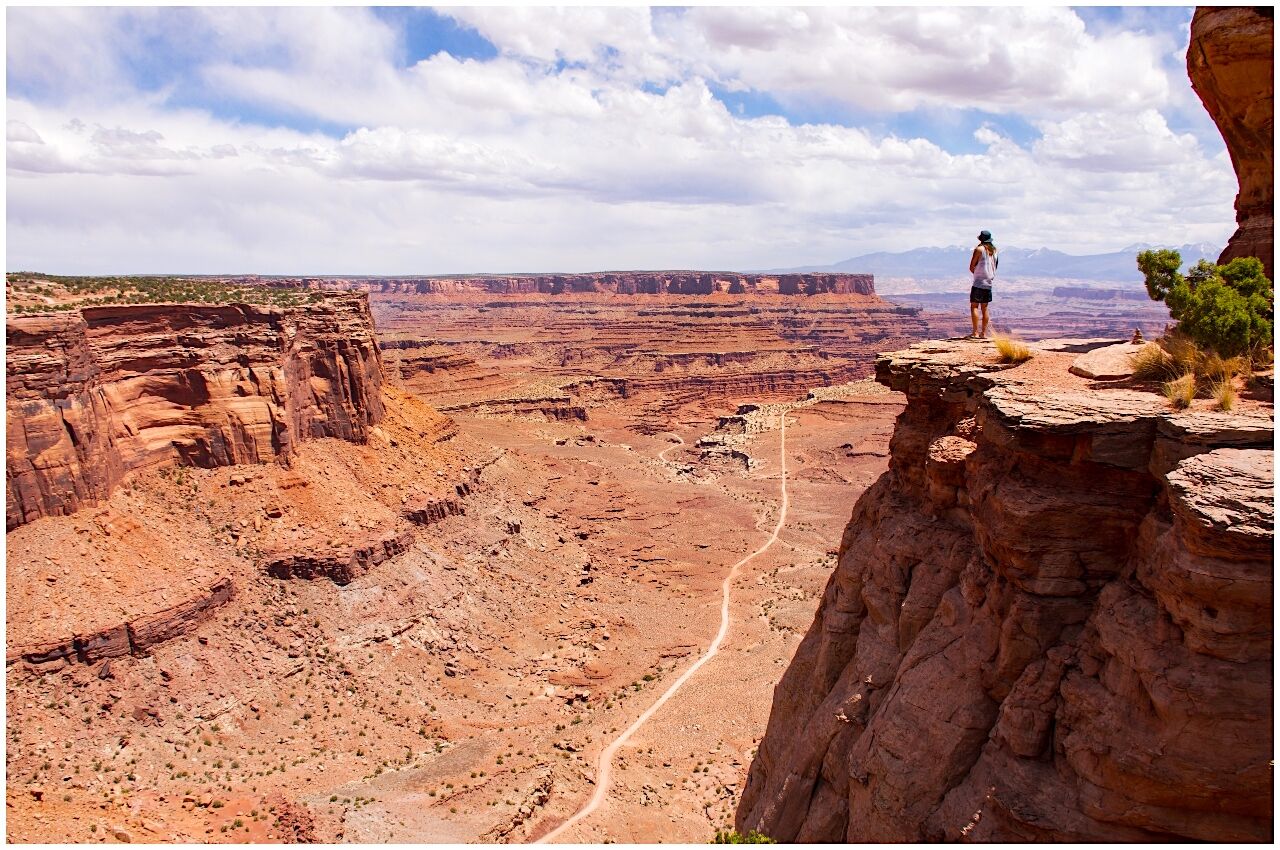 Man standing on edge of canyon in Utah