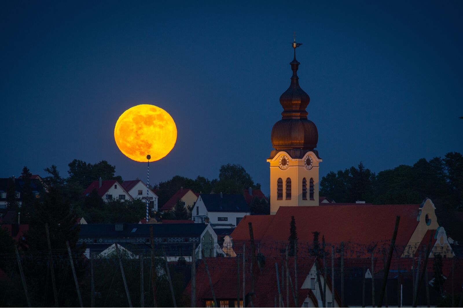 Moonrise of a Supermoon over the town of Wolnzach in Bavaria
