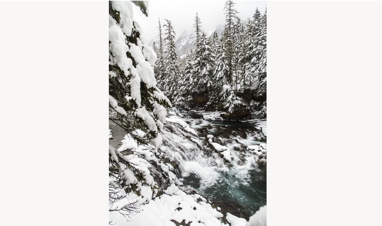A semi-frozen waterfall in Montana's Glacier National Park