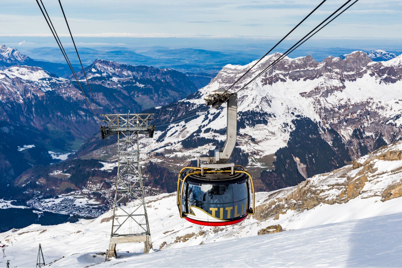 Outside views of the aerial passenger line of the ski resort Engelberg. The rotating cabin is one of the world's coolest ski gondolas
