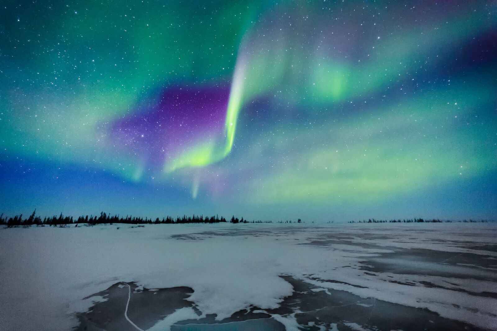 Northern lights above the town of Churchill, Manitoba, in Canada. Churchill is one of the best destinations for Spring Break 2022.