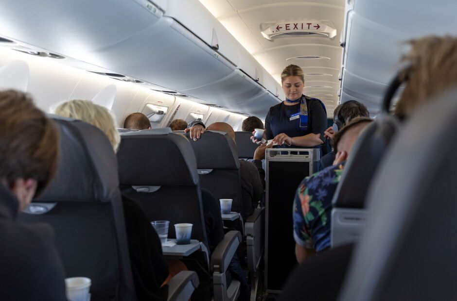 stewardess serving airplane passengers