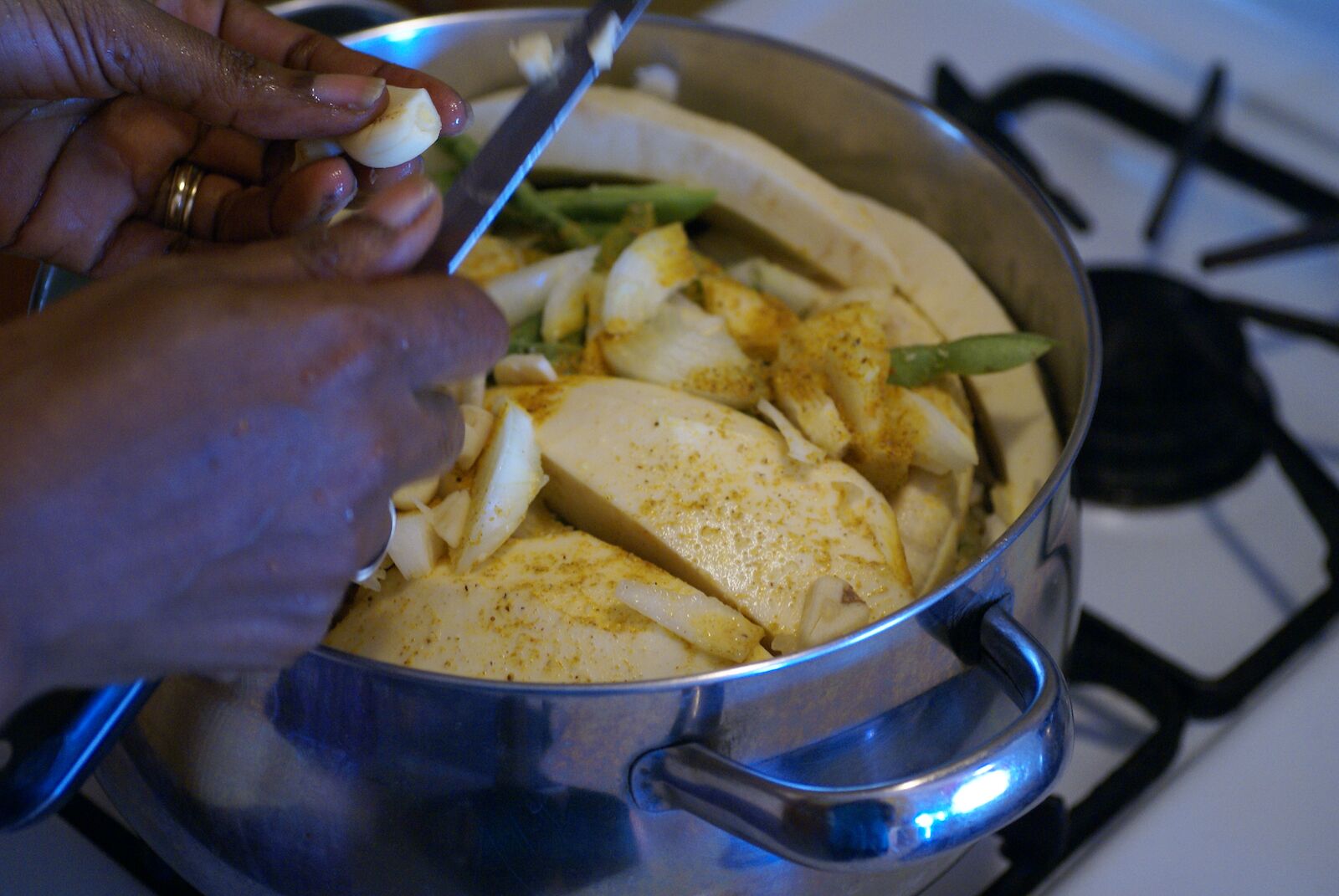 The preparation of Grenada national dish "Oil Down"