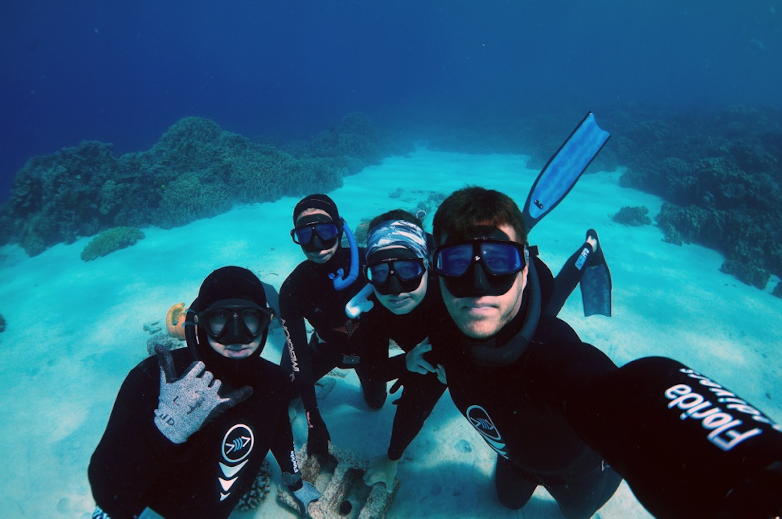 Group of freedivers underwater 