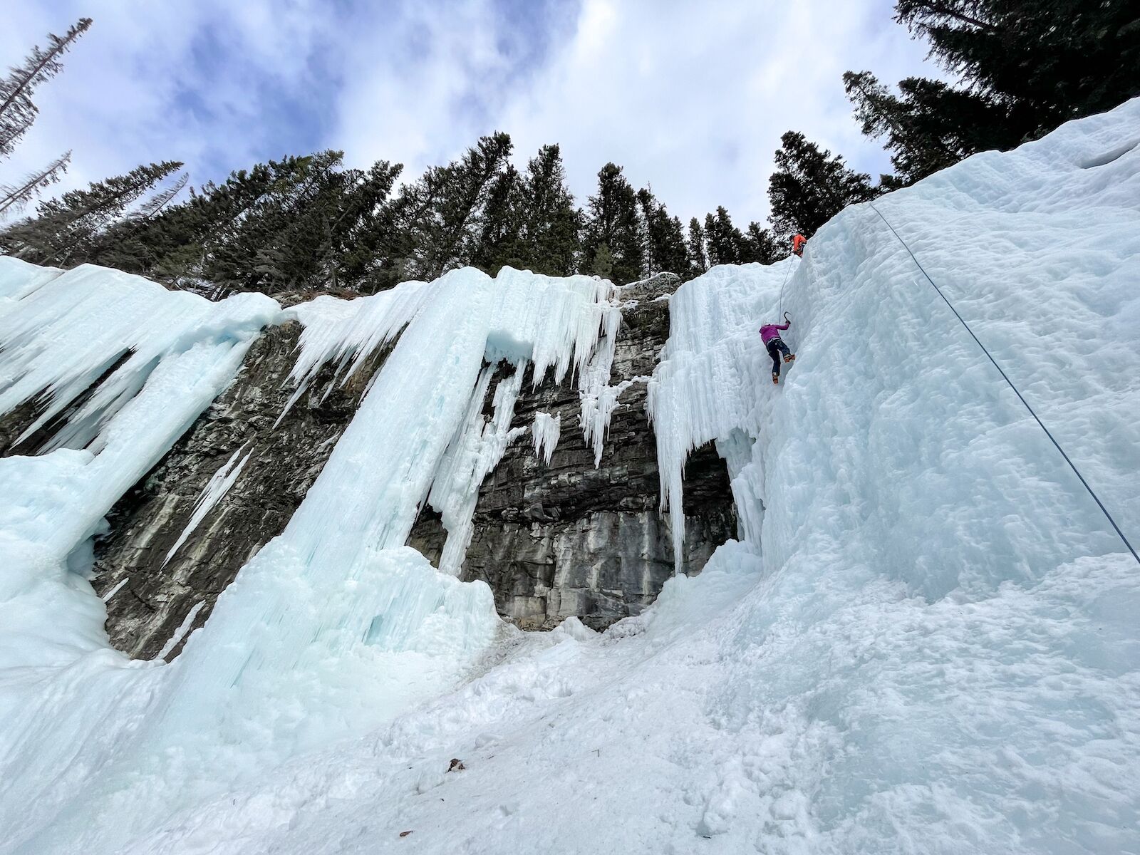 Female ice climber on an easier wall
