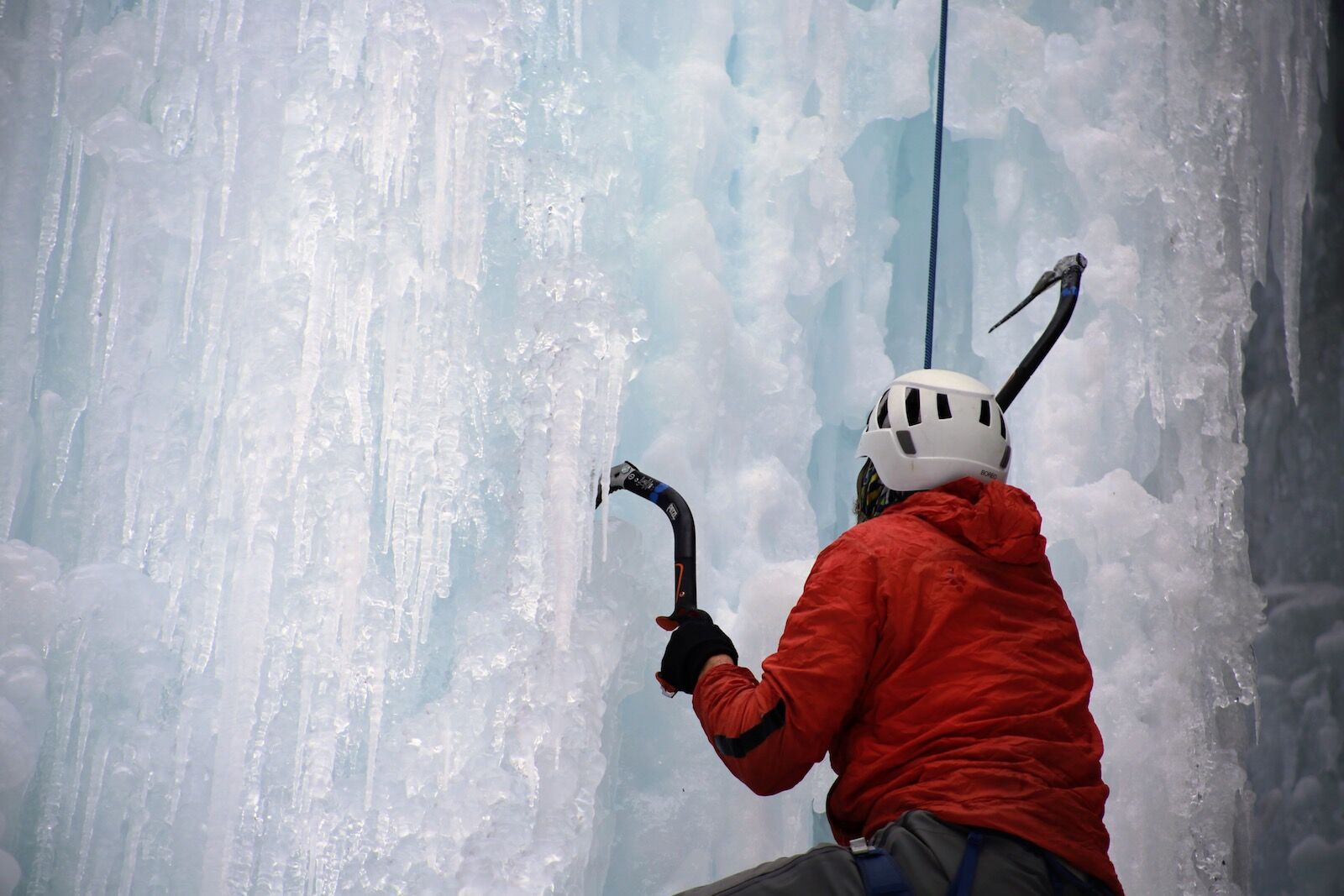 Ice climber with axes