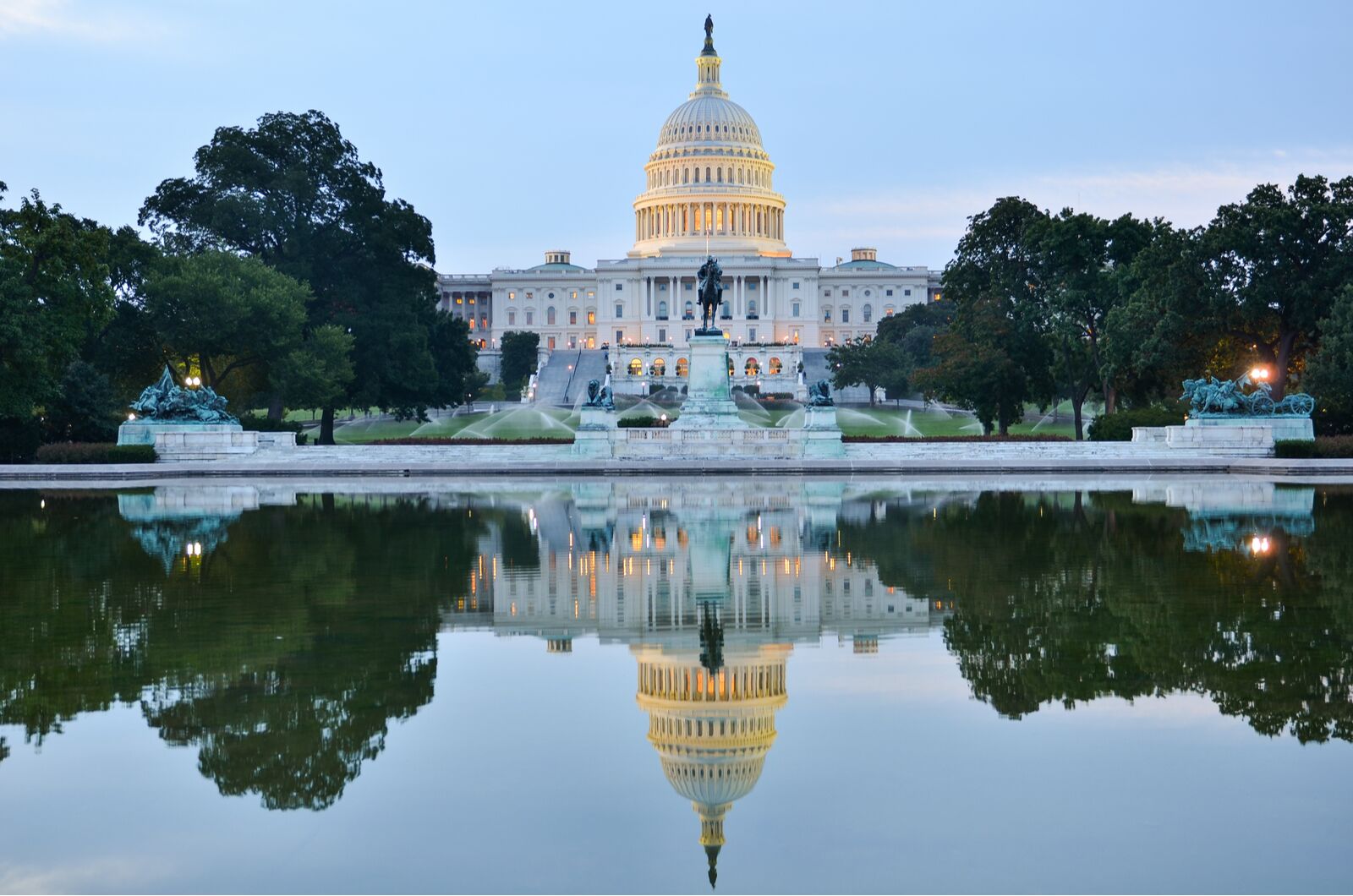 Washington DC, the United States Capitol at cloudy sunrise with a mirror reflection, where to travel