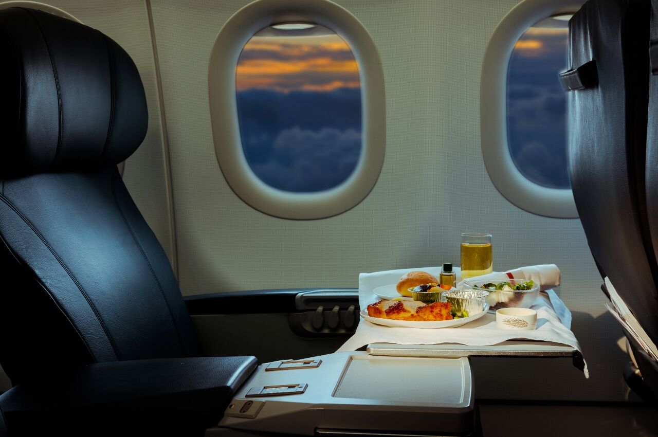 Business class seat with business class meal in airplane 